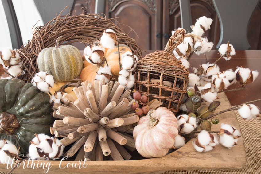 Texture fill fall dough bowl with a wooden orb, ,mini pumpkins and a small wreath.