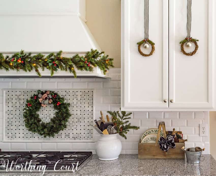 Twigs wreaths on the cabinets and a garland on the hood - all attached with Command Strips.