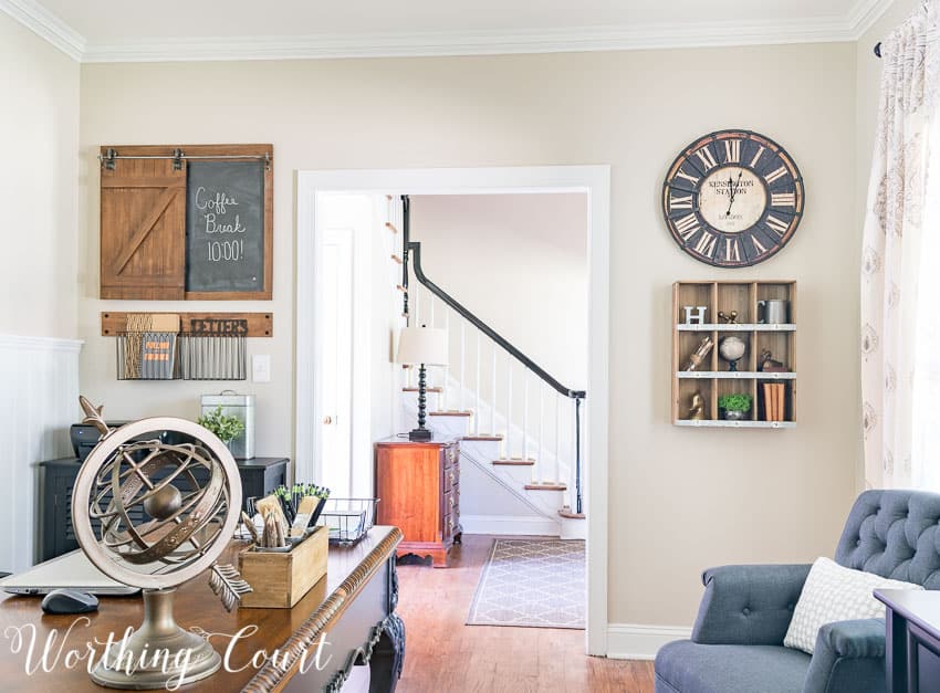 There is a small chalkboard with a wooden sliding barn door detail.