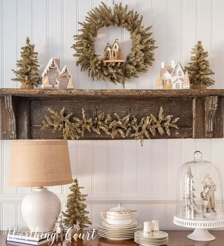 Vintage shelf display for Christmas full of Christmas decor.