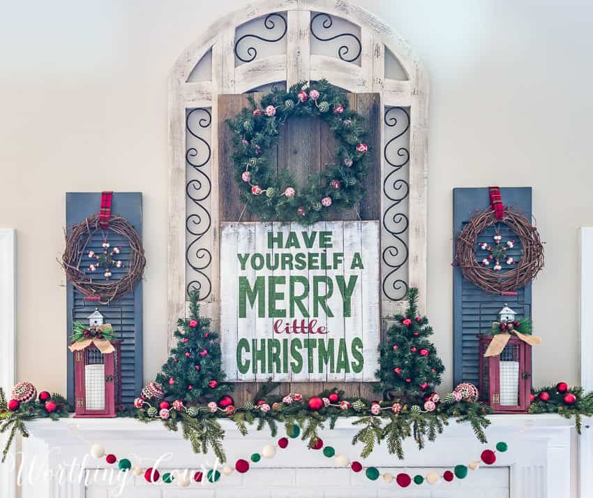 Have yourself a Merry Little Christmas sign on the decorated mantel.