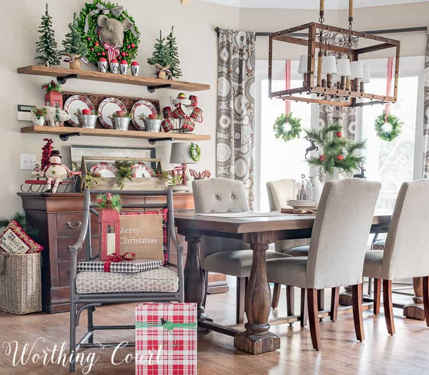 Rustic farmhouse Christmas breakfast nook with open shelving behind the table.