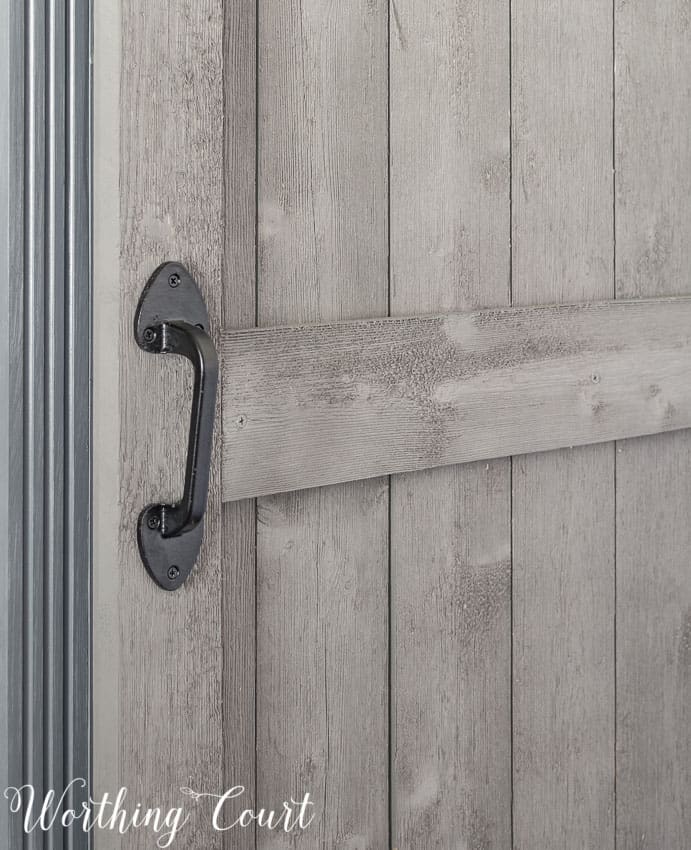 Wrought iron gate handle used on diy sliding barn door.