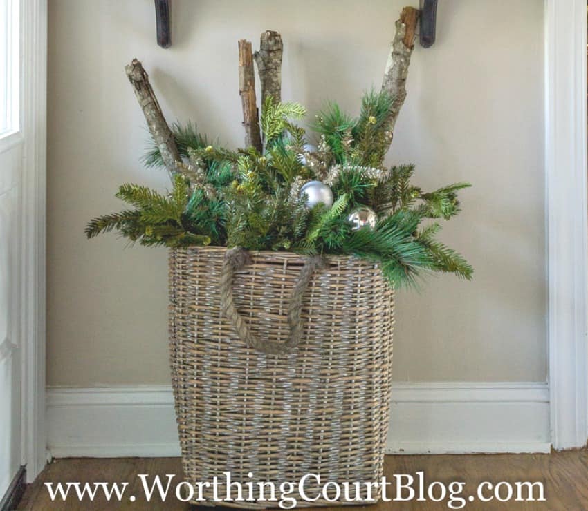 Fill a large basket with an assortment of Christmas greenery, a few sparkly picks, a few shiny ornaments and sticks from your own yard || Worthing Court