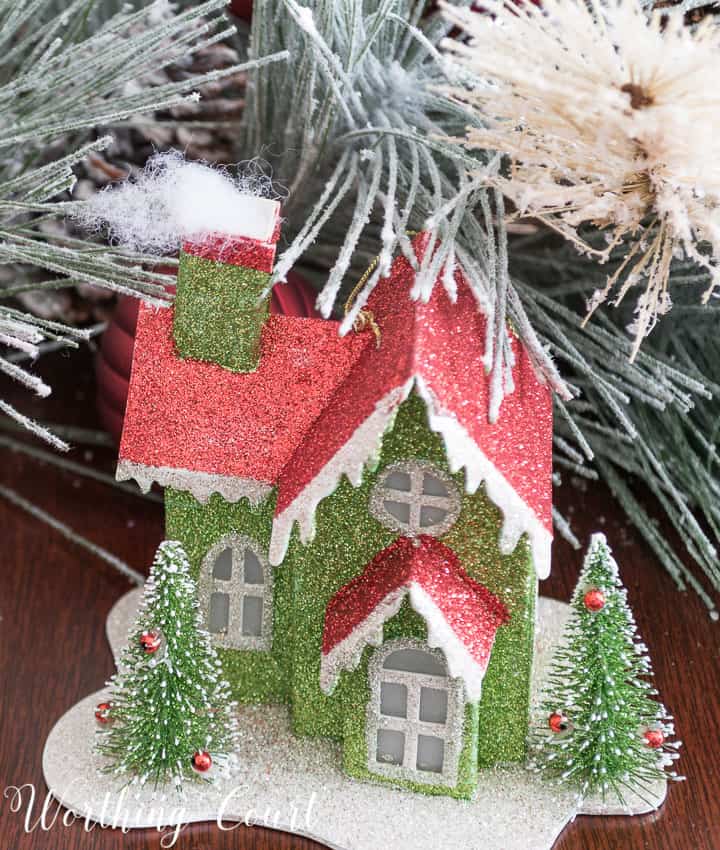 Christmas ornament cardboard glitter house in green and red.