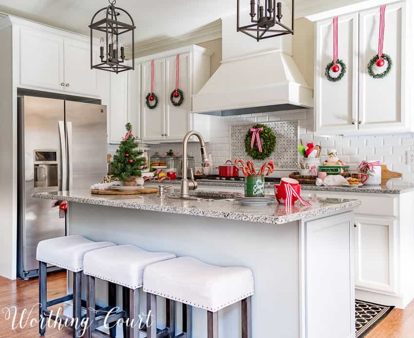 A neutral white kitchen with pops of red and green for Christmas.
