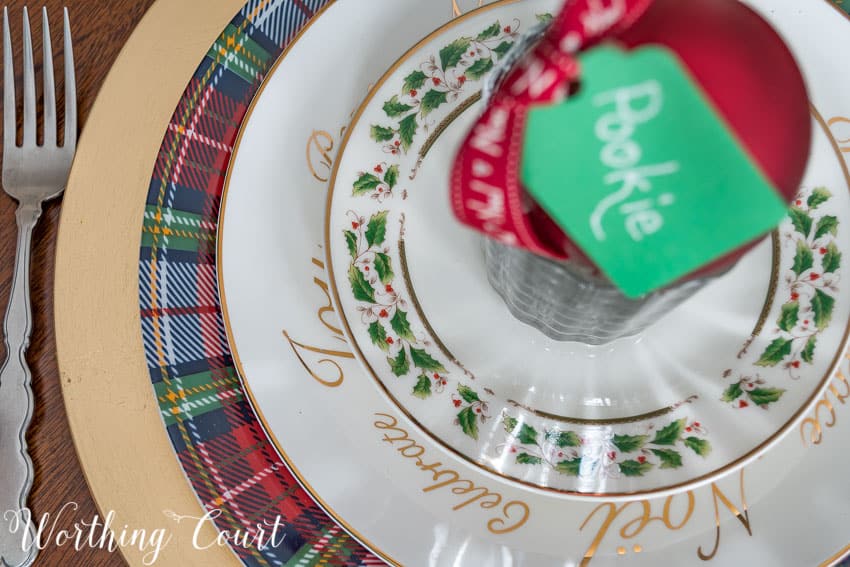 Mixed dinnerware Christmas place setting aerial view.