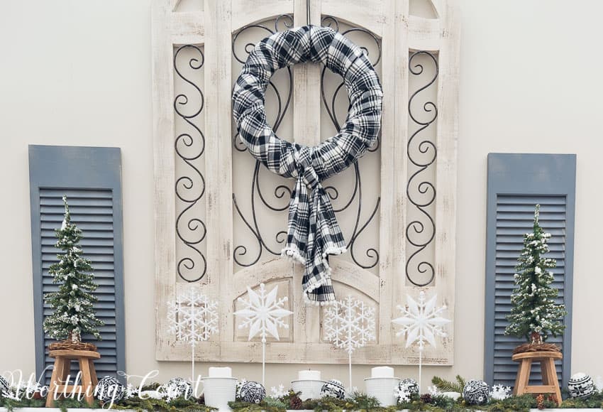 The winter wreath displayed above the mantel.