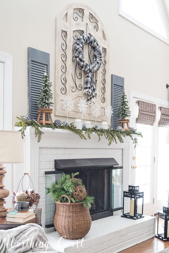 Farmhouse fireplace winter mantel and hearth.