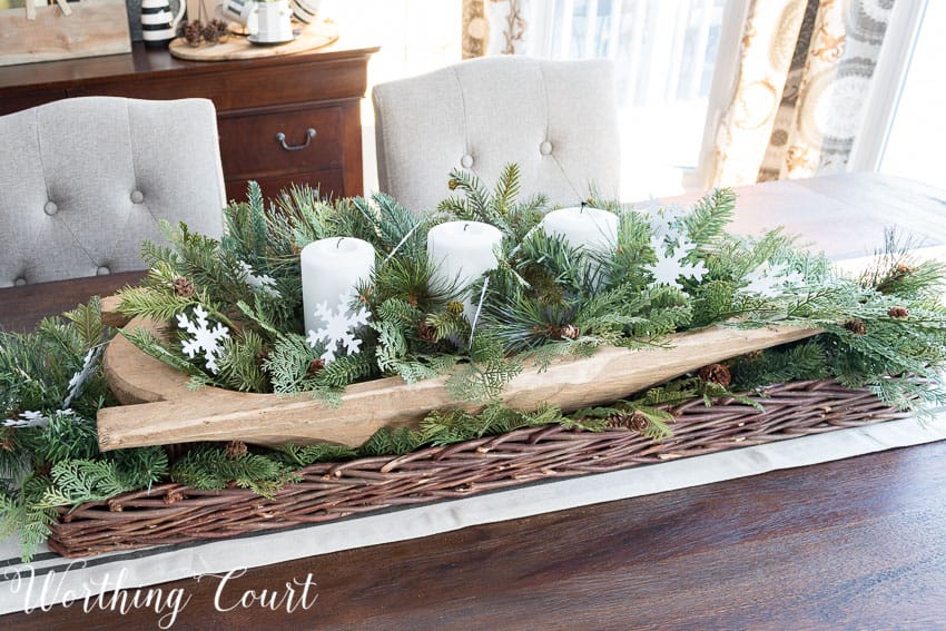 Simple and fast farmhouse winter centerpiece using a dough bowl, white candles and faux Christmas greenery || Worthing Court