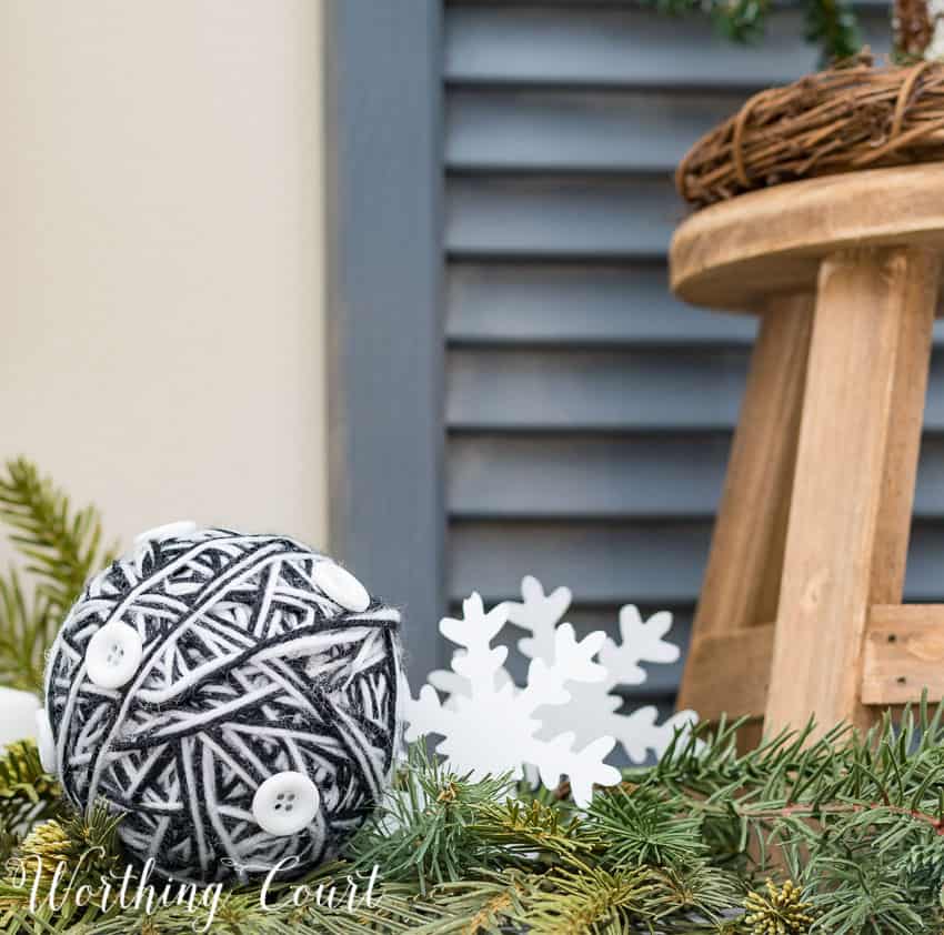 Woolen Christmas balls on the mantel.