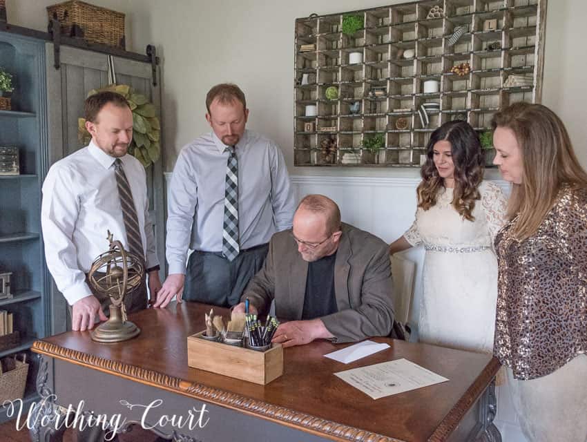 Signing the marriage license.
