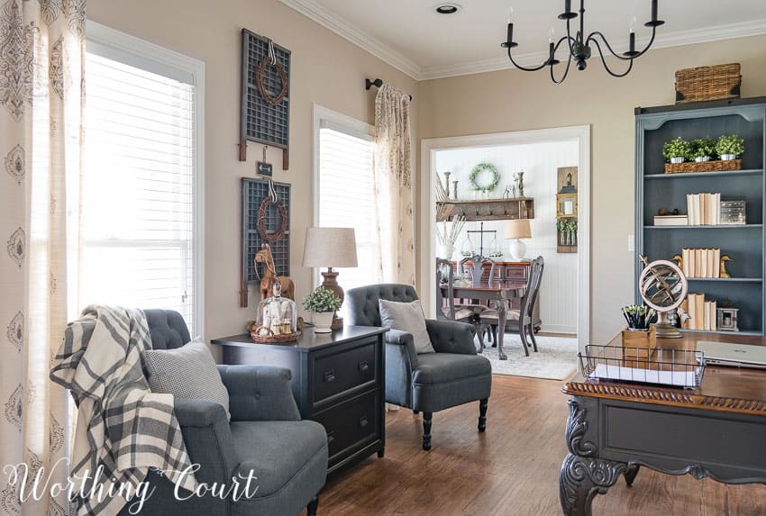 Grey arm chairs flank a lateral file cabinet in a farmhouse style home office || Worthing Court