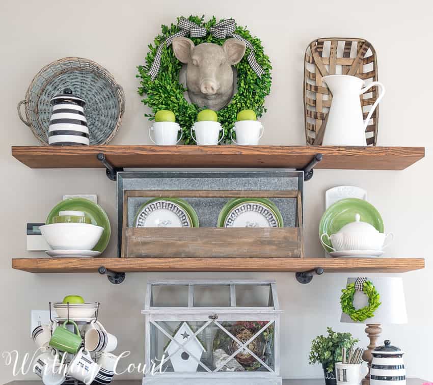 Open rustic industrial farmhouse shelves decorated for spring with black, white and green || Worthing Court