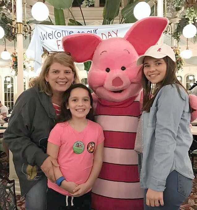 With her Grandkids posing for a picture.