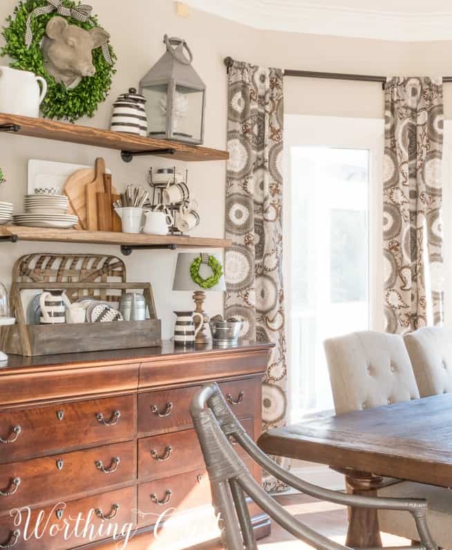 A wood table and a wooden sideboard in the dining room.