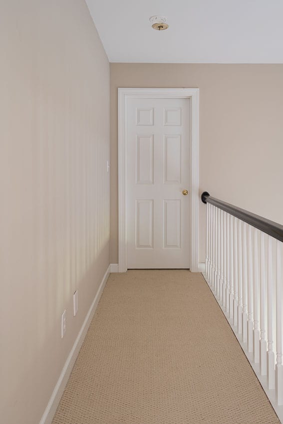 The top of the stairs long narrow hallway.