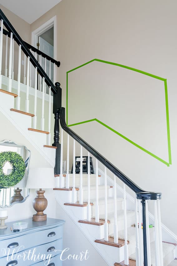 Use painter's tape to help determine the size and layout of a stairway gallery wall.