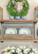 open shelves with blue and green summer decor