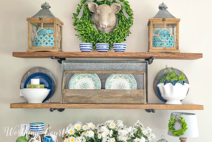 open shelves with blue and green summer decor