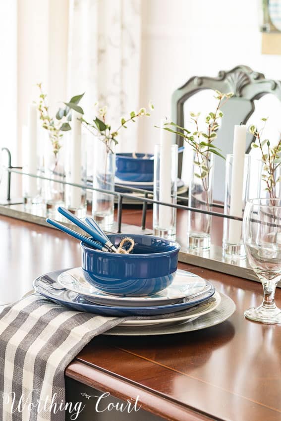 An up close look at the blue dishes and napkin on the dining room table.