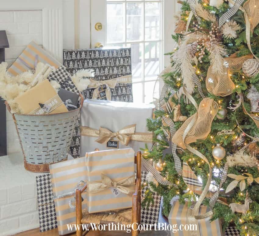 Coordinating Rustic Glam Christmas Wrap plus there is a vintage rustic bucket filled with gifts by the fireplace.