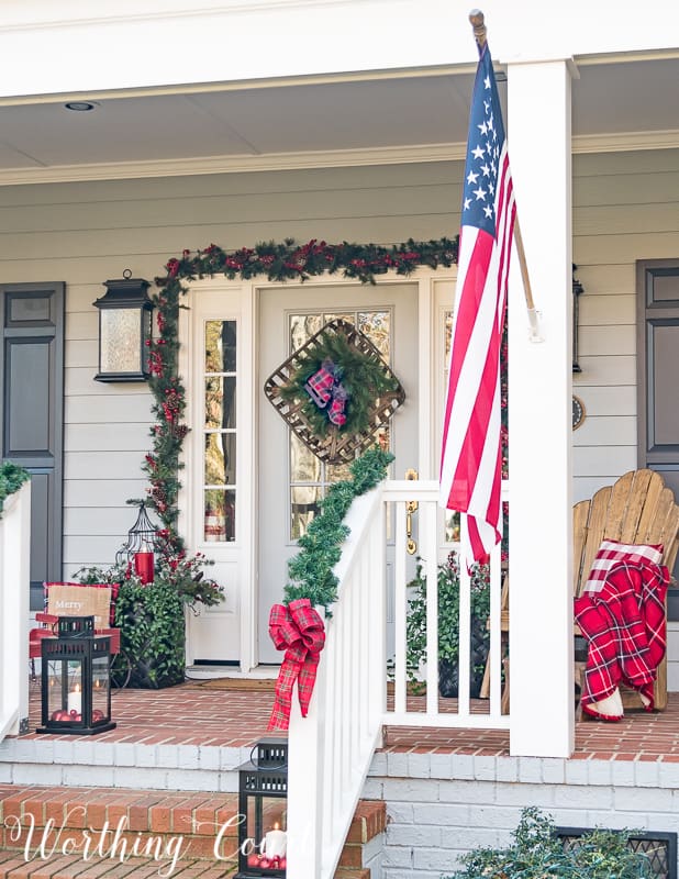 An American flag is on the front of the porch.