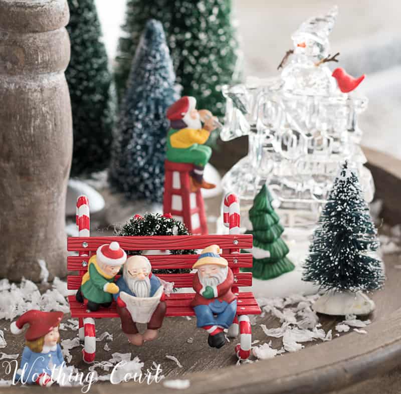 Christmas snow village on a farmhouse wooden two tiered tray.