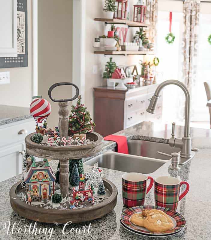 Farmhouse wooden tiered tray filled with Christmas decorations #christmasdecor