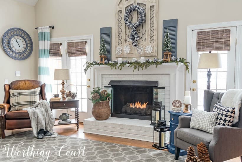Ideas for decorating after Christmas, pictured is a neutral living room with throw pillows and blankets.