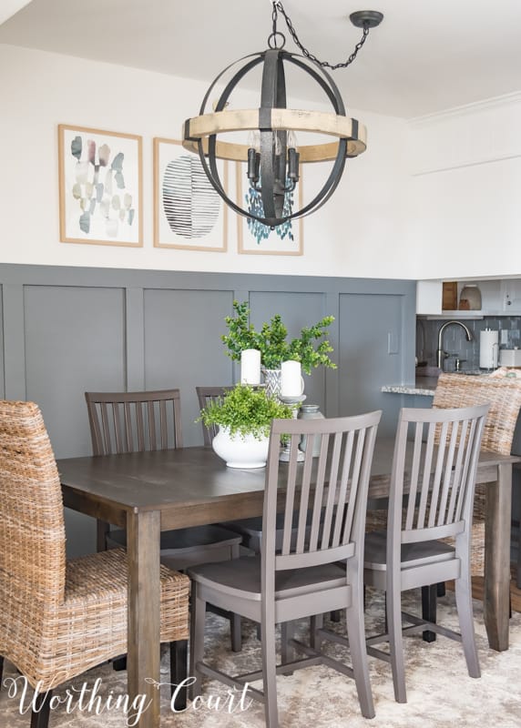 Modern farmhouse dining room, gray board and batten wall, orb chandelier, rustic industrial, abstract art