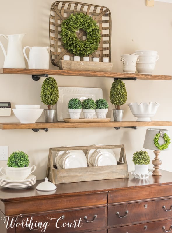 Open wooden shelves decorated for spring.