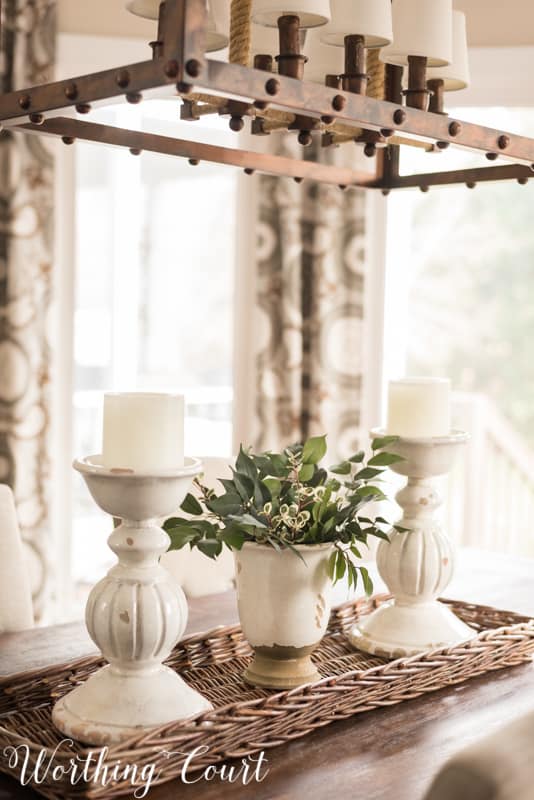 White candlesticks and pottery for the dining room centerpiece.