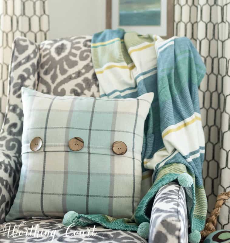 Ikat, stripes and plaid mixed together for interest #howtomixpatterns #coastaldecor #coastaldecoratingideas #turquoise #aqua