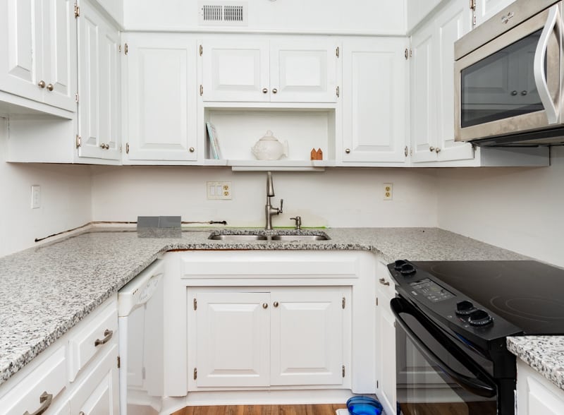 The kitchen cabinets painted white.