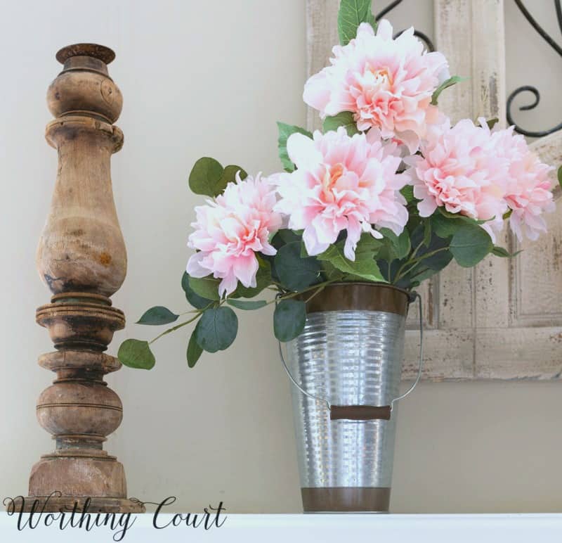 Faux pink peonies in a galvanized vase.