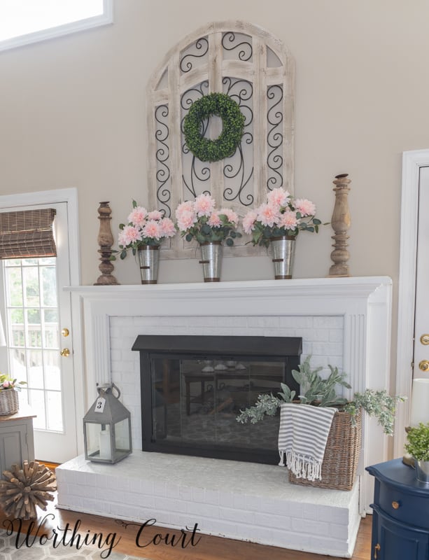 Painted brick fireplace decorated for spring.