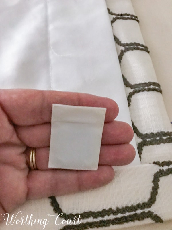 How To Make A Lined, Flat Drapes Just Like The Pros Do - It's Easy! Use a drapery weight in the bottom corner of each panel. #drapesforlivingroom #curtains #draperies #draperypanels #diydrapes #diycurtains #drapetechniques #drapesforslidingglassdoors #windowdrapes