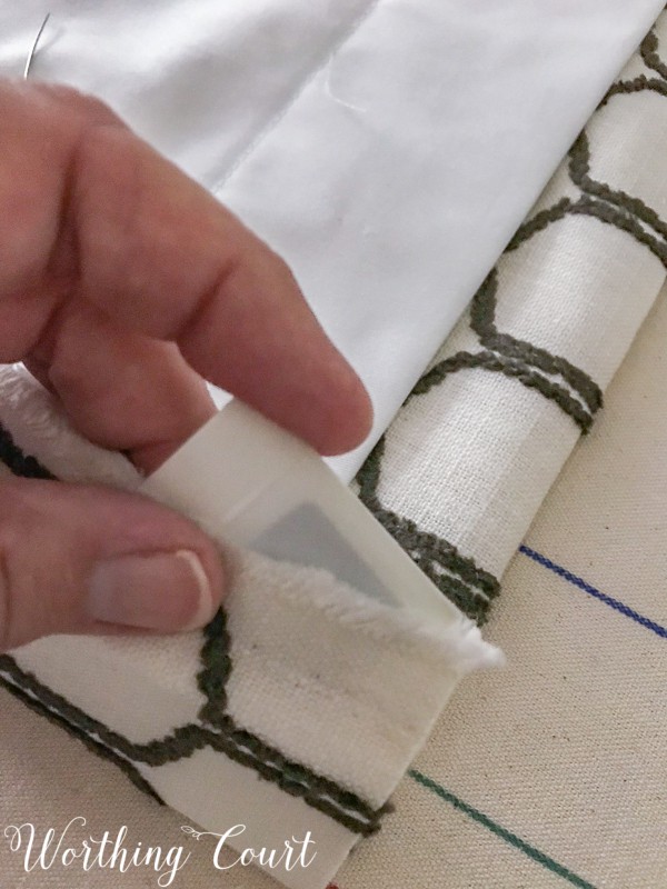 How To Make A Lined, Flat Drapes Just Like The Pros Do - It's Easy! How to insert a drapery weight into the bottom corner of drapes. #drapesforlivingroom #curtains #draperies #draperypanels #diydrapes #diycurtains #drapetechniques #drapesforslidingglassdoors #windowdrapes