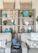 gray bookcases with baskets on top and decorative accessories