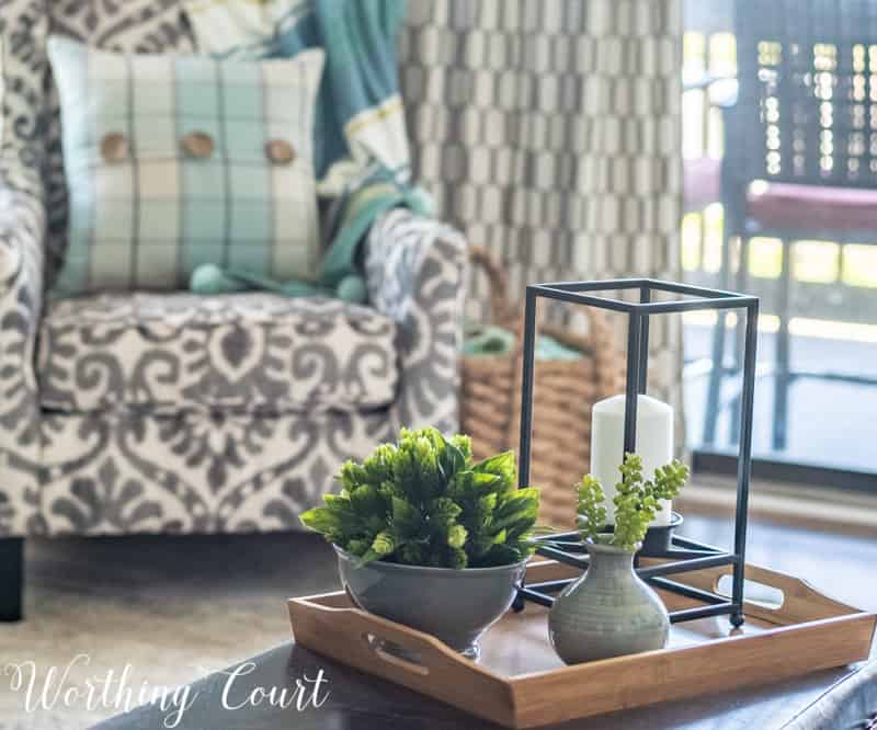 A Living Room Makeover Created With Summer In Mind - Before And After Room Reveal! Modern farmhouse coffee table vignette. #summerdecor #summerdecoratingideas #livingroomdecor #familyroomdecor #modernfarmhousedecoratingideas #WorthingCourtBlog # #neutraldecoratingideas coastaldecoratingideas