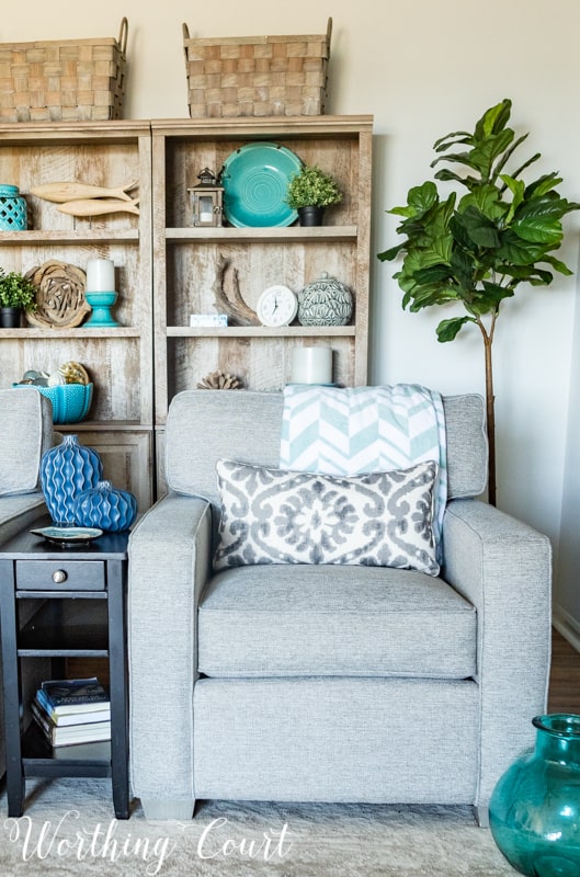 A Living Room Makeover Created With Summer In Mind - Before And After Room Reveal! Artificial trees help to fill empty corners in a room. #summerdecor #summerdecoratingideas #livingroomdecor #familyroomdecor #modernfarmhousedecoratingideas #WorthingCourtBlog # #neutraldecoratingideas coastaldecoratingideas