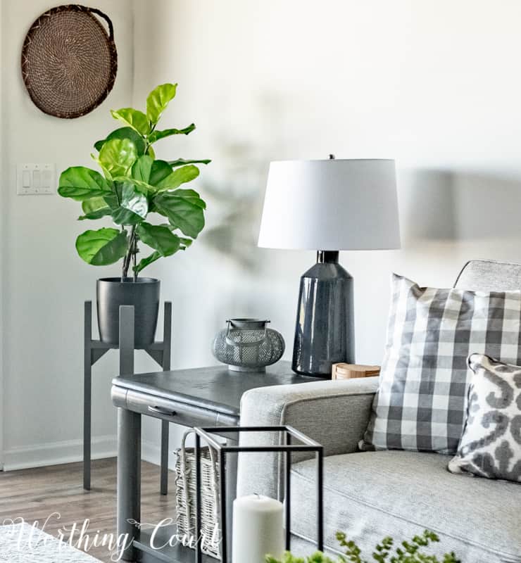 A Living Room Makeover Created With Summer In Mind - Before And After Room Reveal! Faux fiddle leaf fig on a modern plant stand. #summerdecor #summerdecoratingideas #livingroomdecor #familyroomdecor #modernfarmhousedecoratingideas #WorthingCourtBlog # #neutraldecoratingideas coastaldecoratingideas