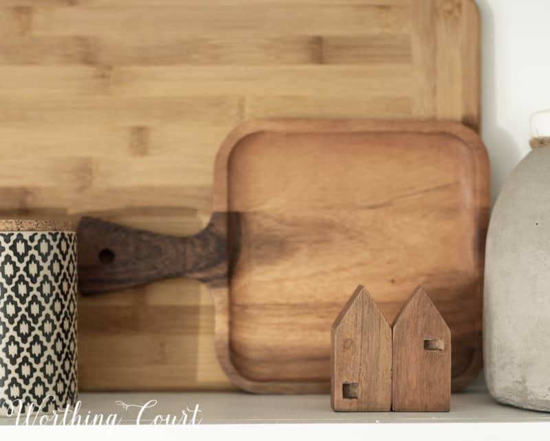 A wooden cutting board on the kitchen counter.