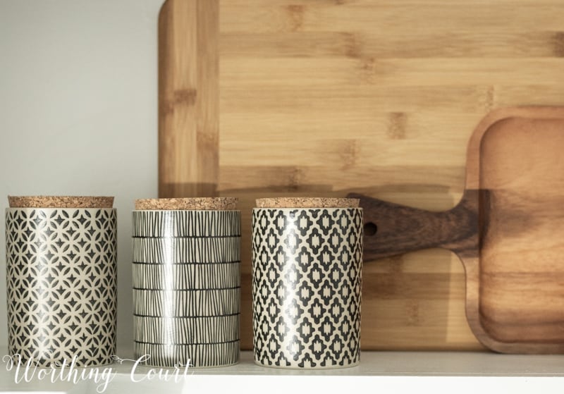 Pretty decorative containers on the counter.