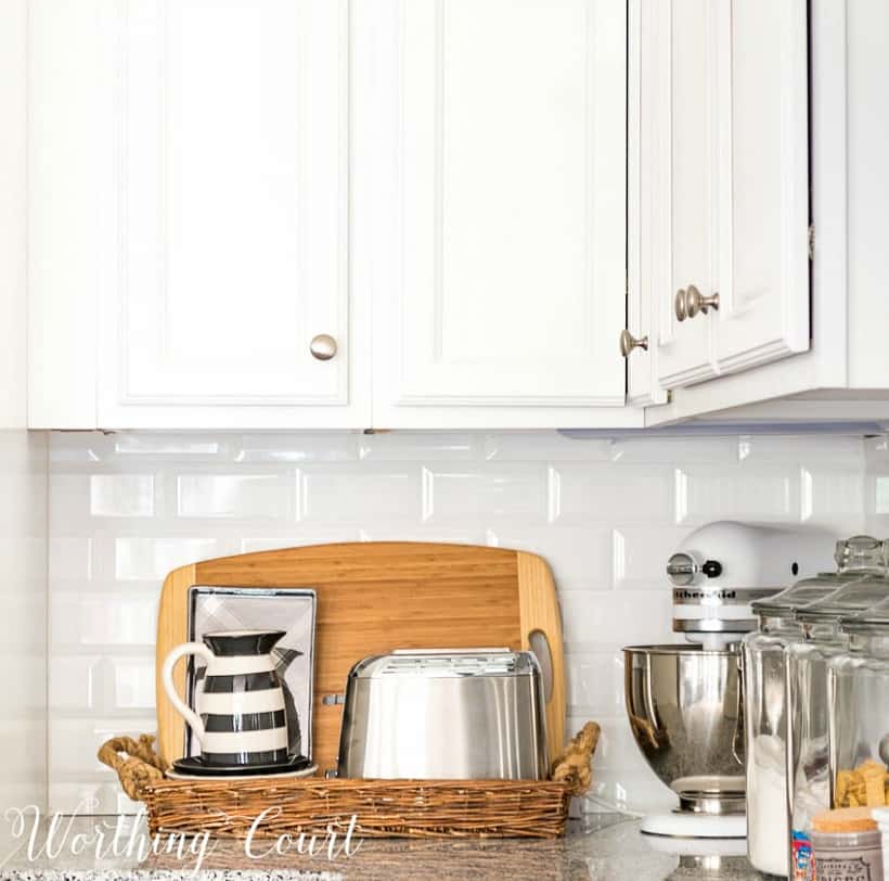 Organized cutting boards and small appliances in a tray on your kitchen counter. 
