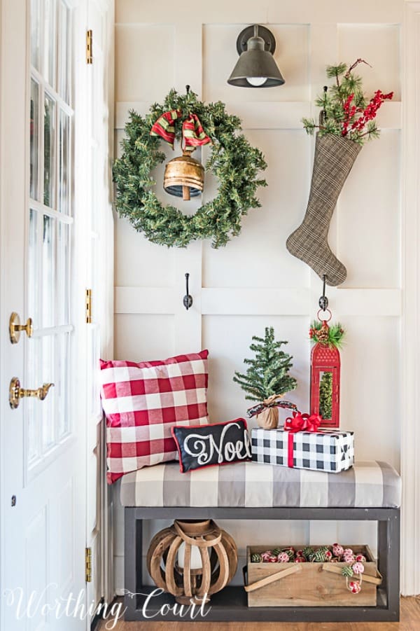 Hooks added to a board and batten wall hold seasonal decorations and become "art". #artideas #wallartideas #artworkideas #diyart #artworkdisplay