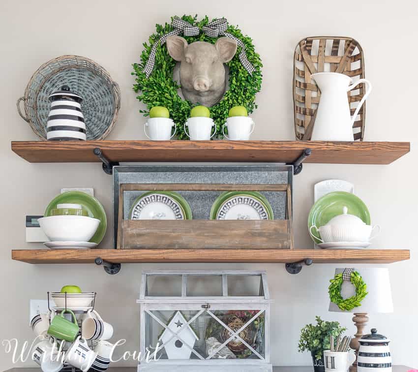 diy shelves filled with thrifted treasures are a great way to decorate on a budget