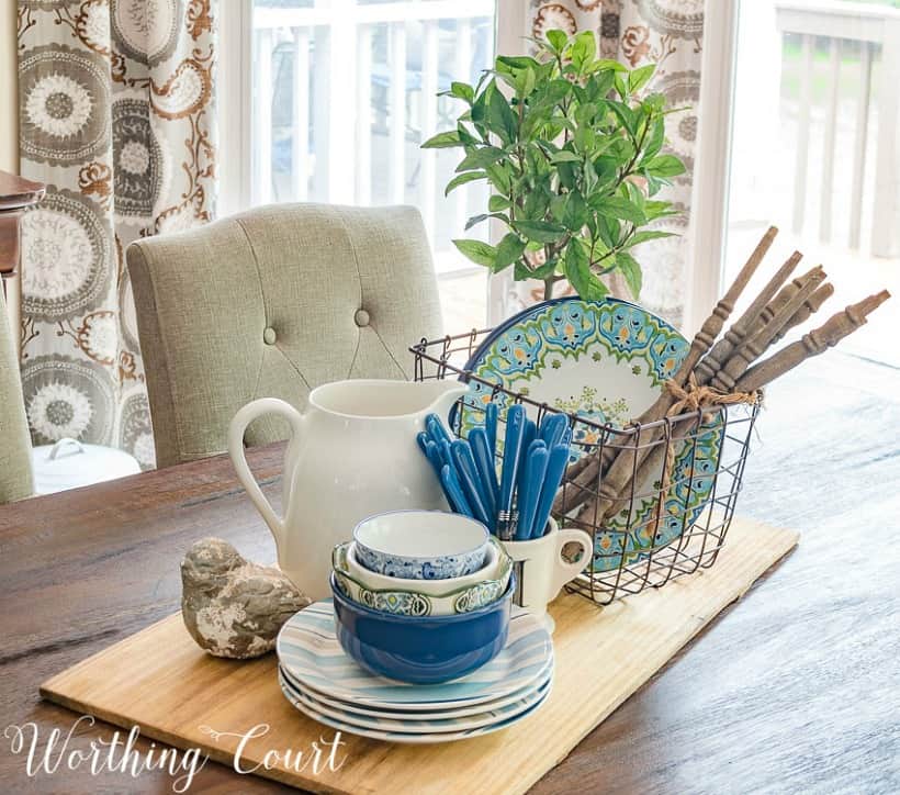 spring centerpiece with blue and white dishes