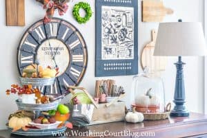 sideboard decorated for fall with traditional fall colors
